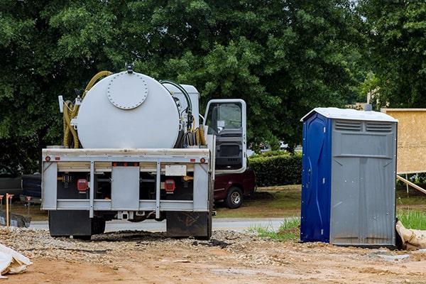 Portable restroom rental team and equipment